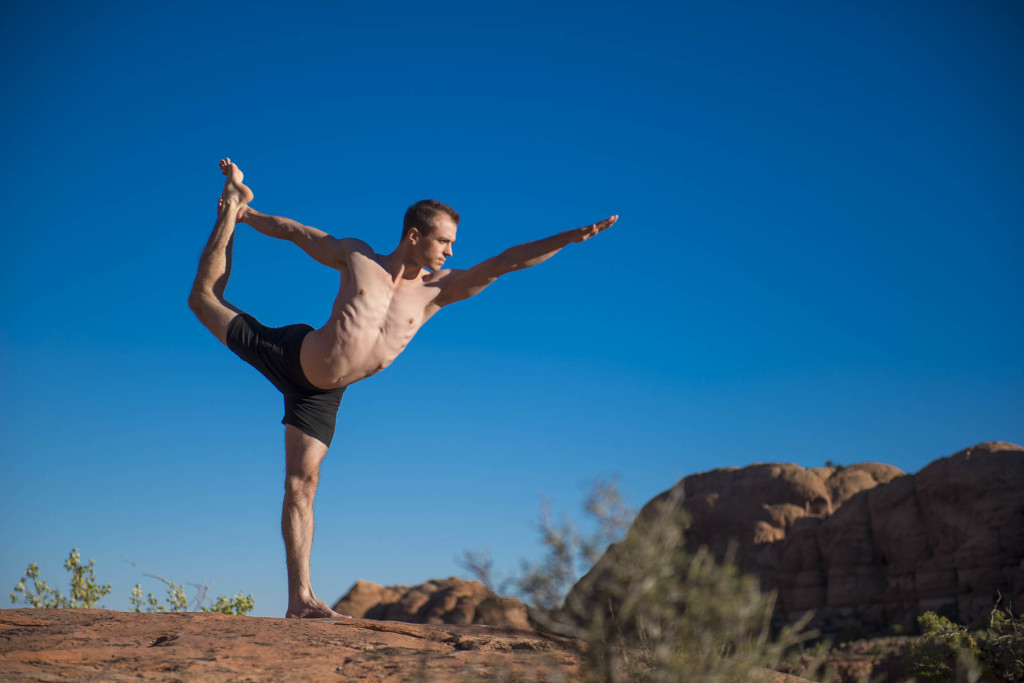 Man doing yoga outdoors
